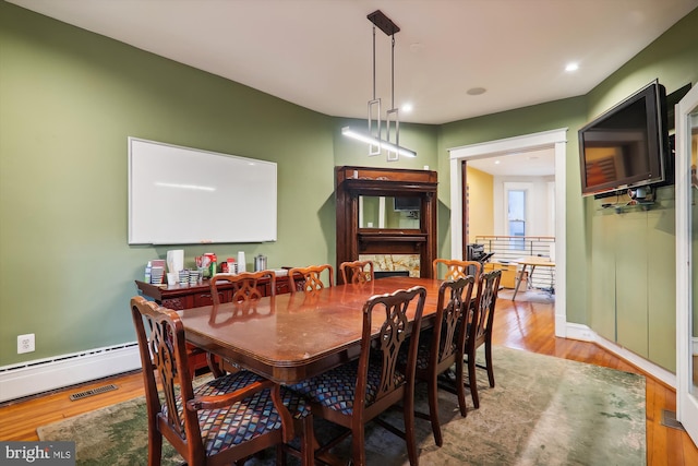 1312 Pennsylvania Ave SE, Washington, DC 20003 - dining area with wood finished floors, recessed lighting, a baseboard radiator, and baseboards
