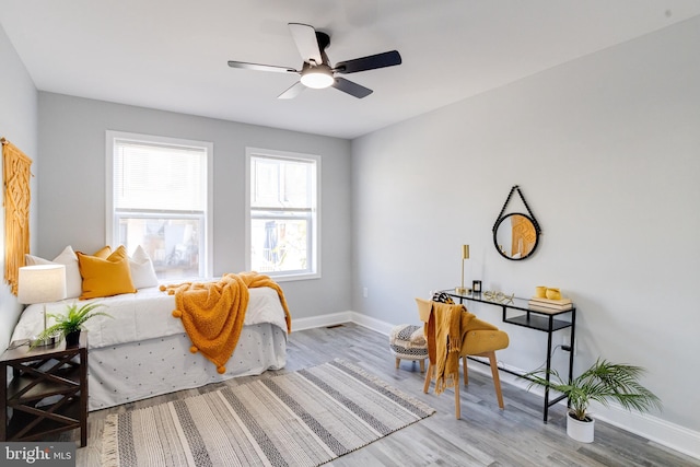 bedroom featuring hardwood / wood-style floors and ceiling fan