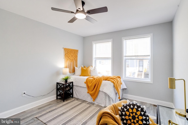 bedroom featuring hardwood / wood-style flooring and ceiling fan