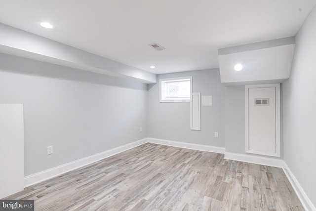 basement featuring light hardwood / wood-style flooring