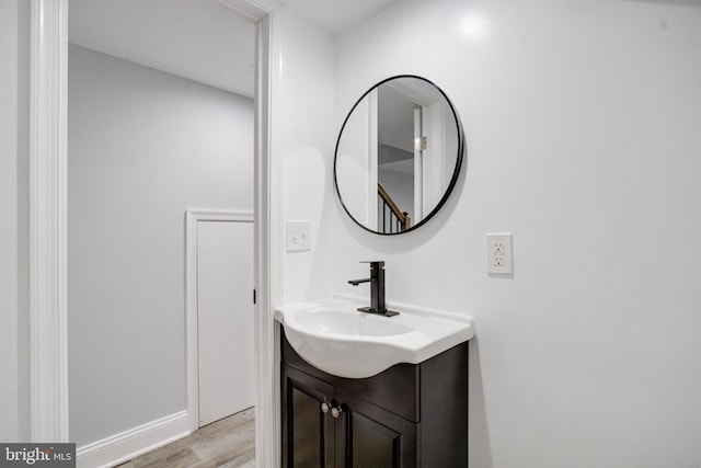 bathroom with vanity and hardwood / wood-style flooring