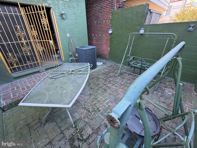 view of patio featuring central air condition unit