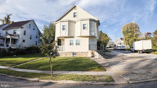 view of front of house with a front lawn