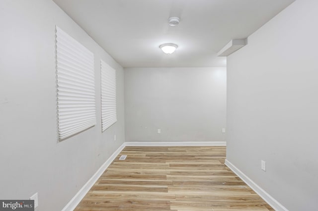 spare room with light hardwood / wood-style floors