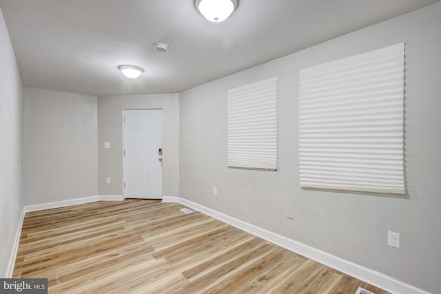 spare room with light hardwood / wood-style flooring