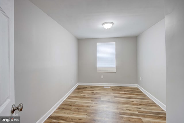 spare room with light wood-type flooring