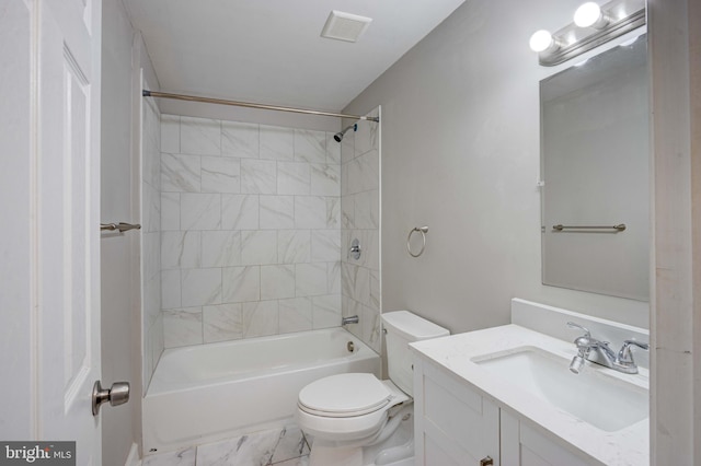 full bathroom with vanity, toilet, and tiled shower / bath