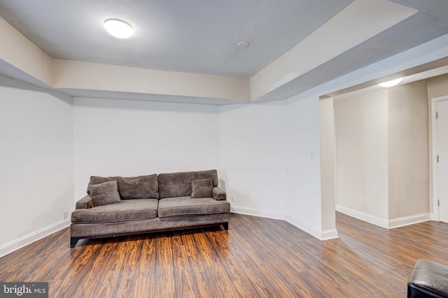 sitting room with dark hardwood / wood-style flooring