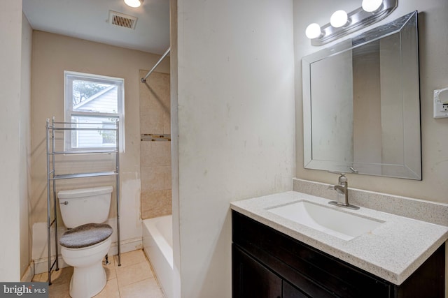 full bathroom with vanity, tile patterned floors, toilet, and tiled shower / bath