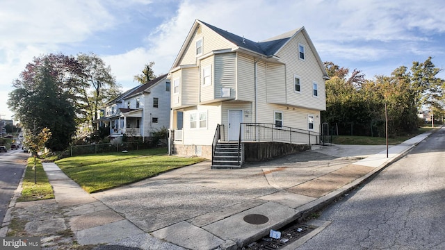 view of home's exterior with a lawn