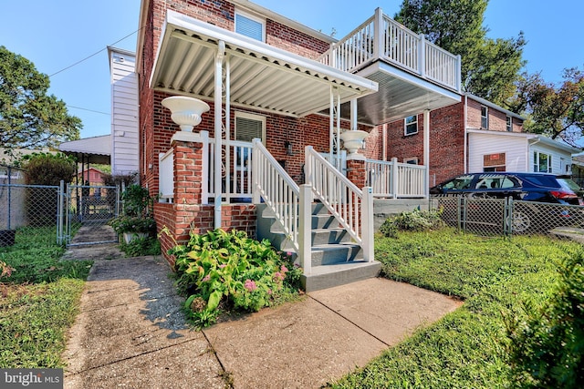 exterior space featuring a balcony and a porch