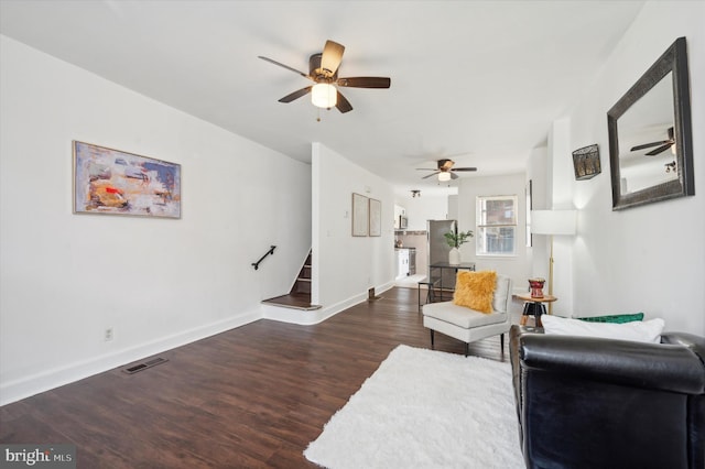 living room featuring dark wood-type flooring