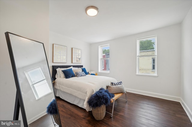 bedroom featuring dark hardwood / wood-style flooring