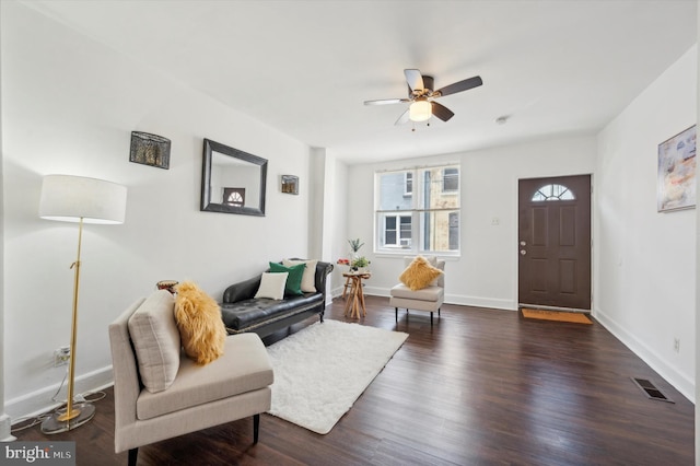 interior space with dark wood-type flooring and ceiling fan