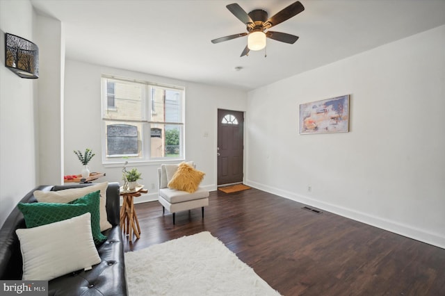 sitting room featuring ceiling fan and dark hardwood / wood-style flooring