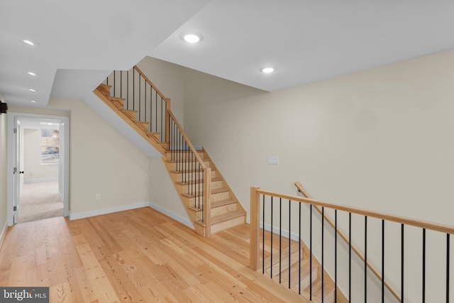 stairs with wood-type flooring