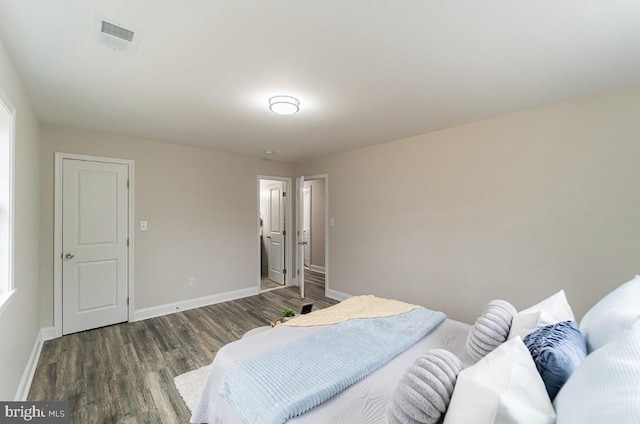 bedroom featuring dark hardwood / wood-style flooring