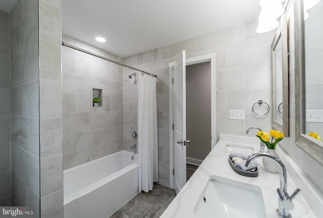 bathroom with shower / tub combo and vanity