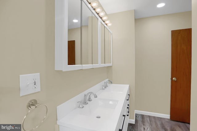 bathroom with vanity and hardwood / wood-style flooring