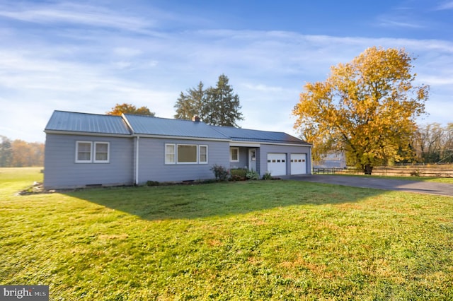 single story home featuring a front yard and a garage