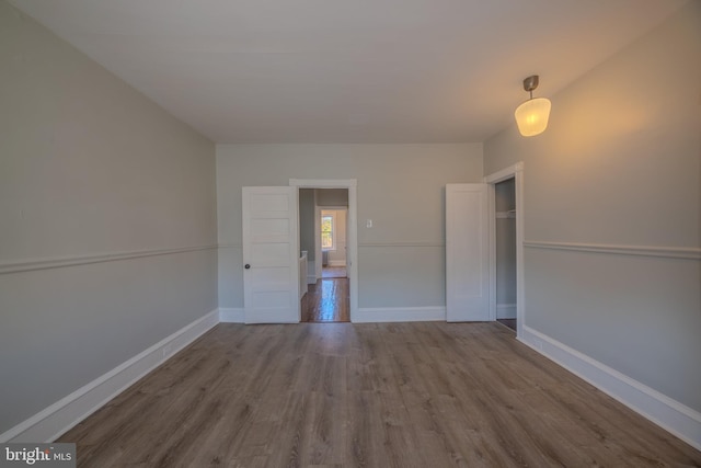 spare room with hardwood / wood-style flooring