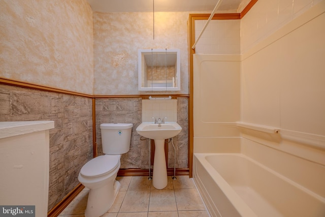 bathroom with tile patterned flooring, sink, and toilet