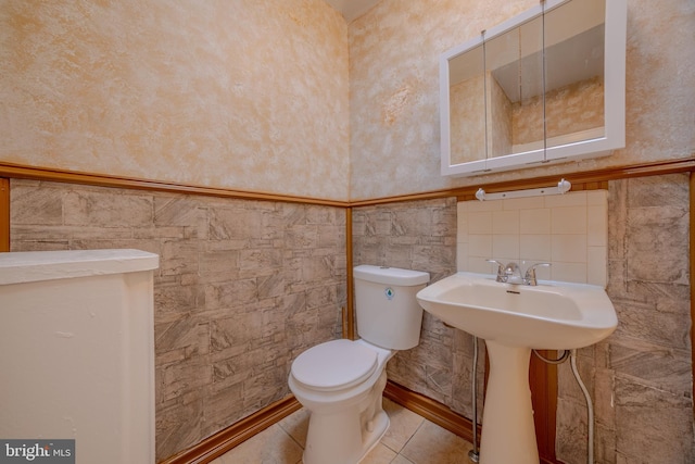 bathroom featuring toilet and tile patterned floors