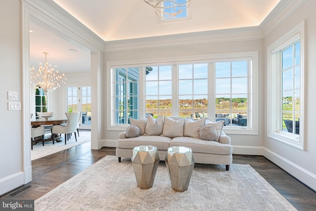 sunroom / solarium featuring a chandelier and a healthy amount of sunlight