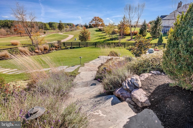 view of yard with a rural view