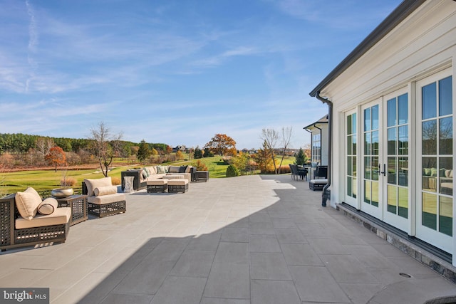 view of patio / terrace with french doors and an outdoor living space