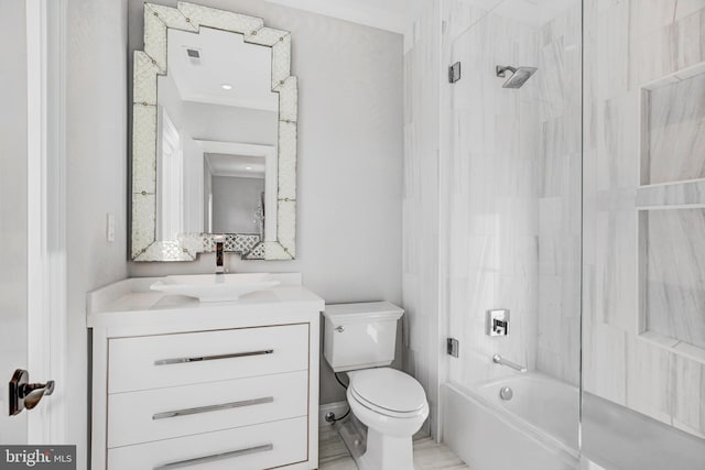 full bathroom featuring toilet, vanity, and tiled shower / bath