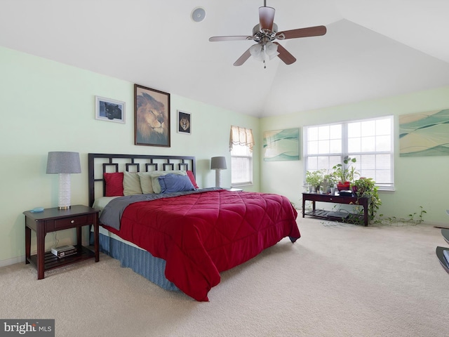 bedroom with carpet floors, ceiling fan, and vaulted ceiling