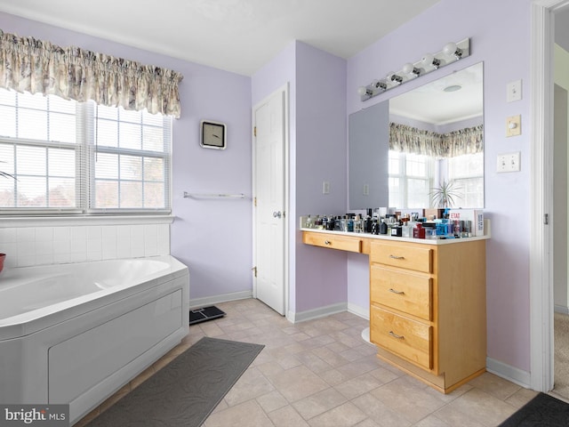 bathroom with a bath and vanity