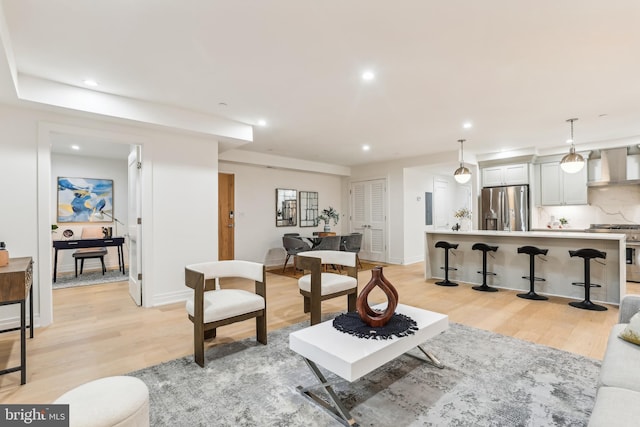 living room with light hardwood / wood-style flooring