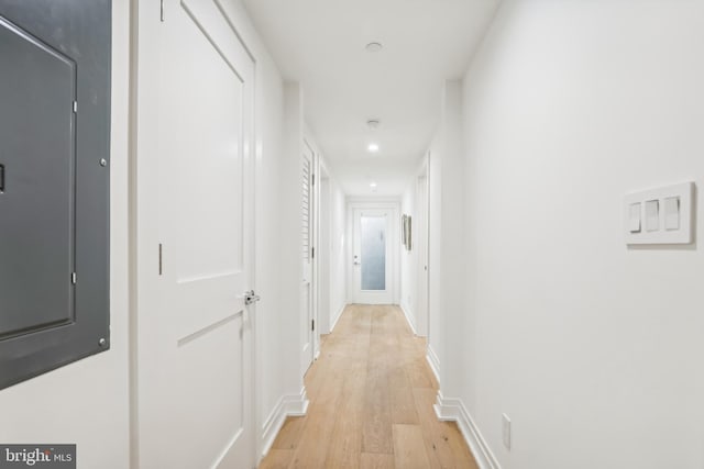 hall with light hardwood / wood-style floors