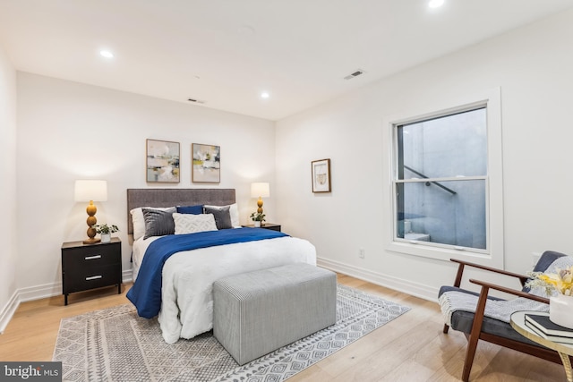 bedroom with light hardwood / wood-style floors