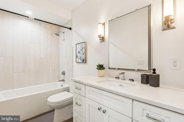 full bathroom featuring tile patterned floors, vanity, tiled shower / bath combo, and toilet