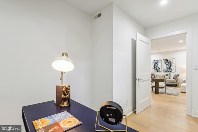 corridor featuring hardwood / wood-style flooring