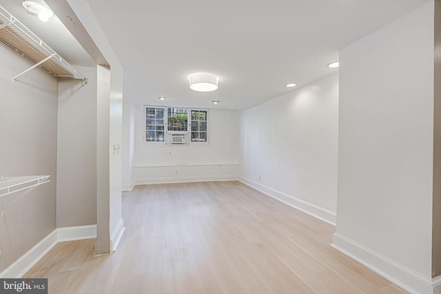 interior space featuring light wood-type flooring and cooling unit