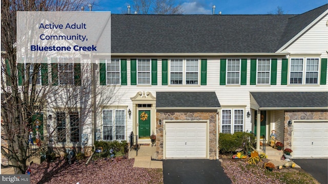 multi unit property featuring a garage