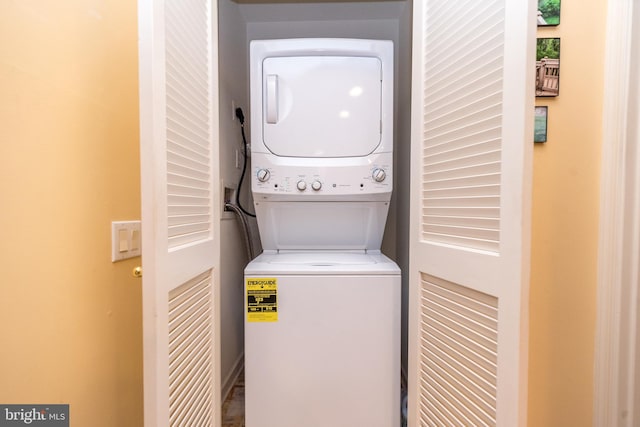 laundry area with stacked washer / dryer