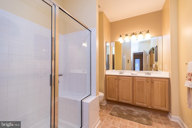 bathroom with vanity, toilet, and walk in shower