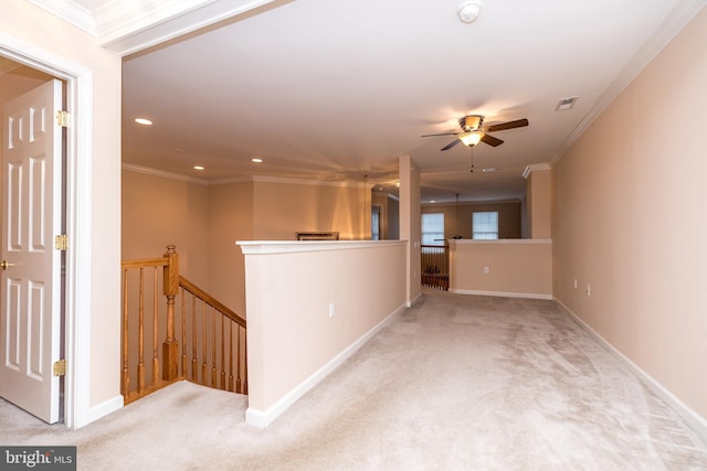 hall with light carpet and ornamental molding