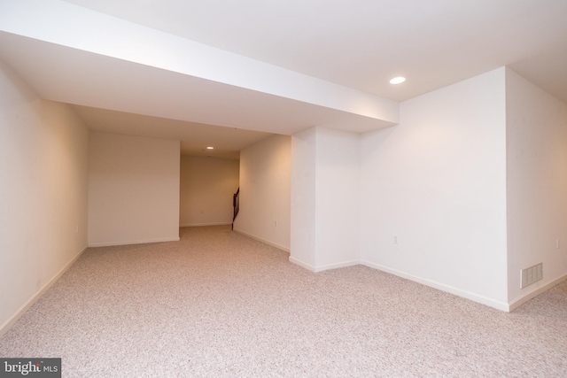 basement with light colored carpet