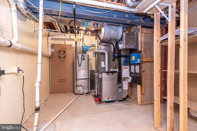 utility room featuring heating unit and gas water heater