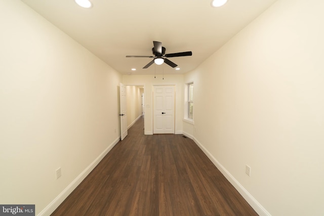 corridor featuring dark wood-type flooring