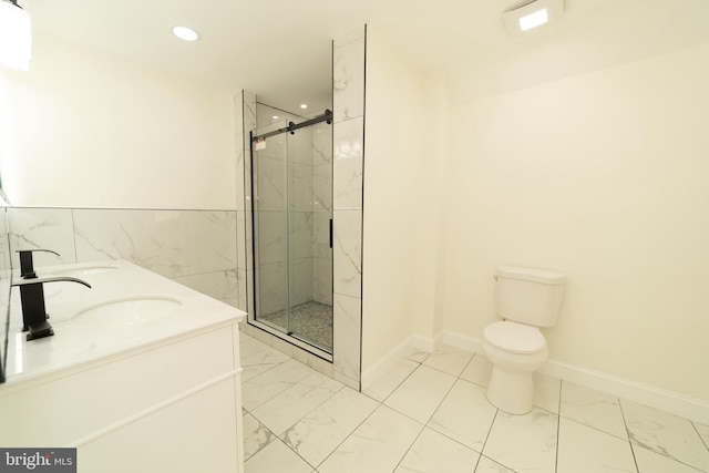 bathroom featuring an enclosed shower, vanity, and toilet