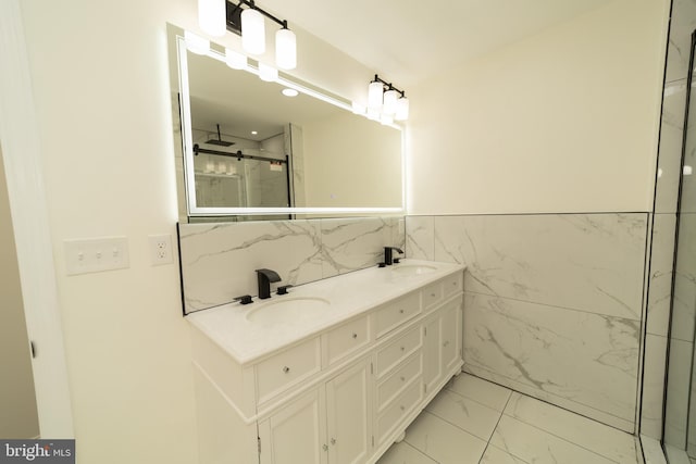 bathroom featuring tile walls, vanity, and a shower with door