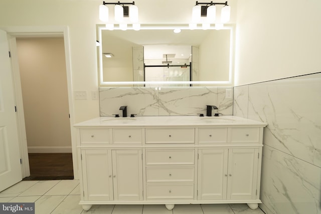 bathroom featuring tile walls, vanity, and tile patterned flooring