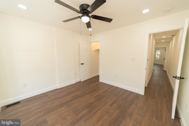 unfurnished room featuring ceiling fan and dark hardwood / wood-style floors